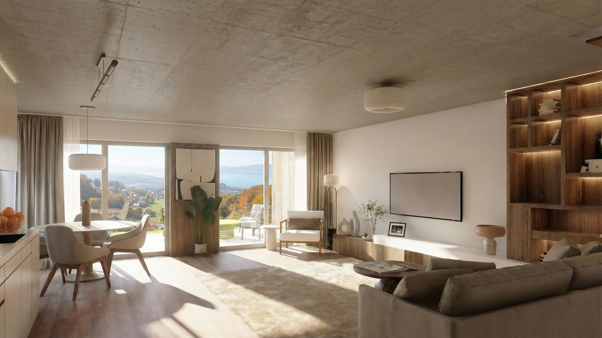 Séjour-salle à manger contemporain et lumineux avec cuisine ouverte, parquet, mobilier beige et grandes baies vitrées donnant sur une terrasse et un paysage vallonné avec le lac au loin.